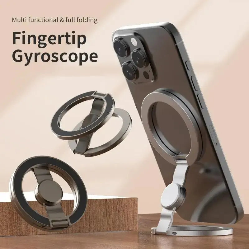 A silver dual magnetic phone stand and fidget spinner accessory shown next to a smartphone.