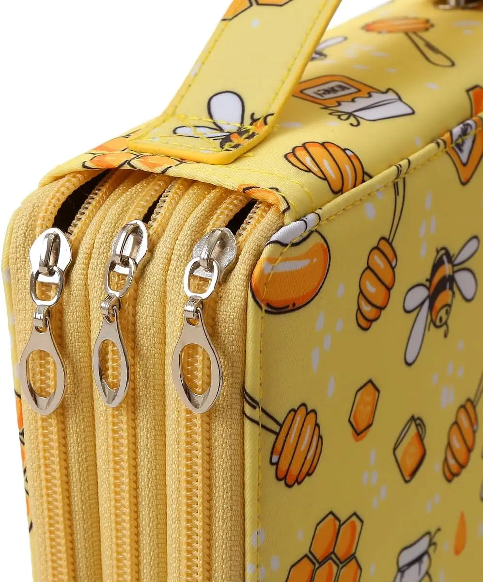 A yellow pencil case with a zipper closure and a pattern featuring orange and white fruit designs.