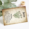 A brown botanical herbal reference card featuring a sprig of greenery and text about the properties of yarrow.