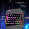 A black T-Wolf backlit gaming keyboard and mouse combo with colorful RGB lighting effects.