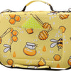 A yellow pencil case with honeycomb patterns and multiple compartments is shown.