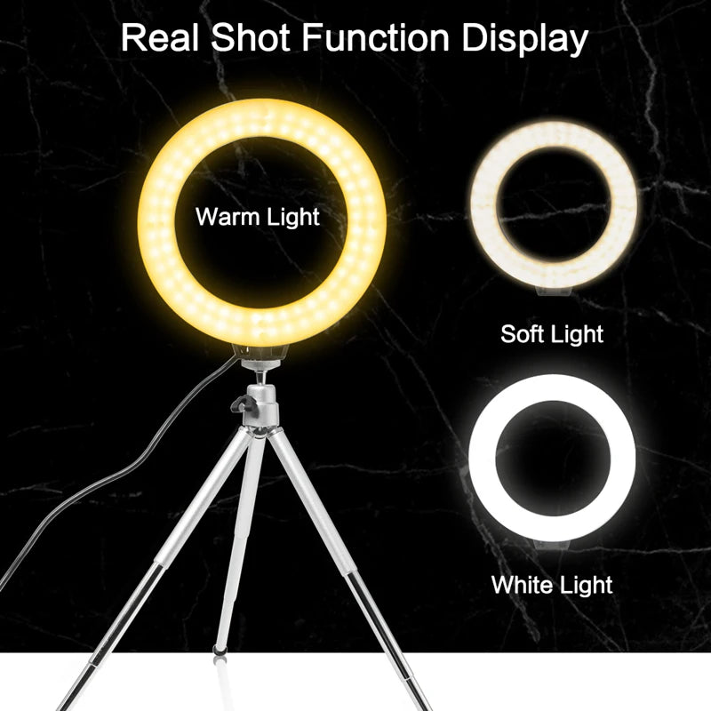 A tripod-mounted ring light displaying warm, soft, and white light options.