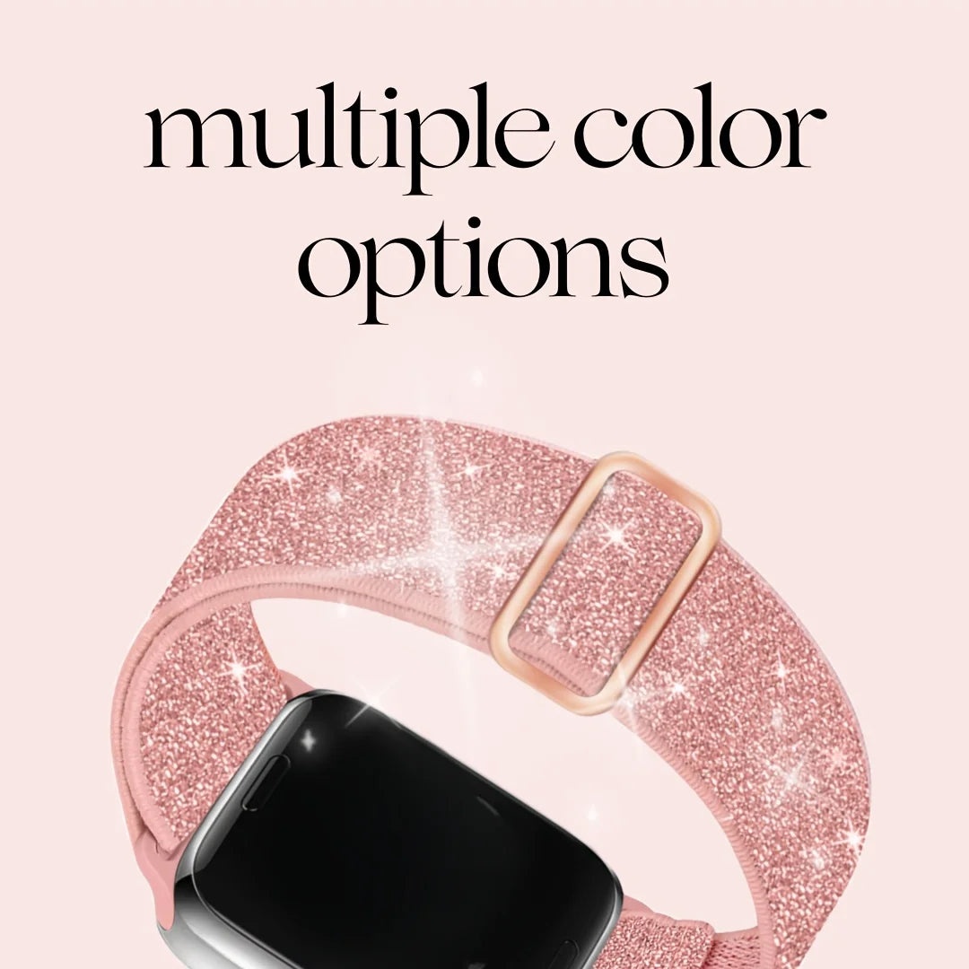 A pink glitter nylon strap for an Apple Watch is shown on a wrist.