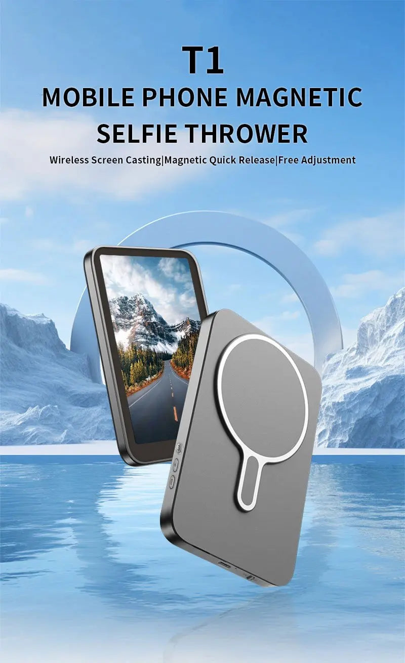 A gray magnetic phone selfie thrower device is shown next to a smartphone, set against a snowy mountain background.