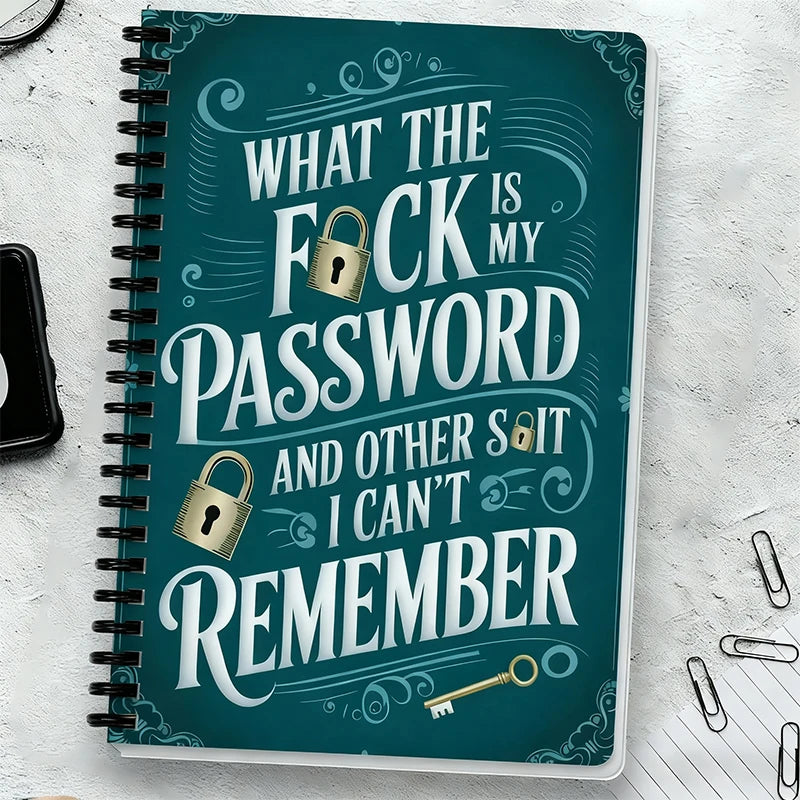 A teal spiral notebook titled What the fuck is my password and other shit I can't remember with decorative swirls.