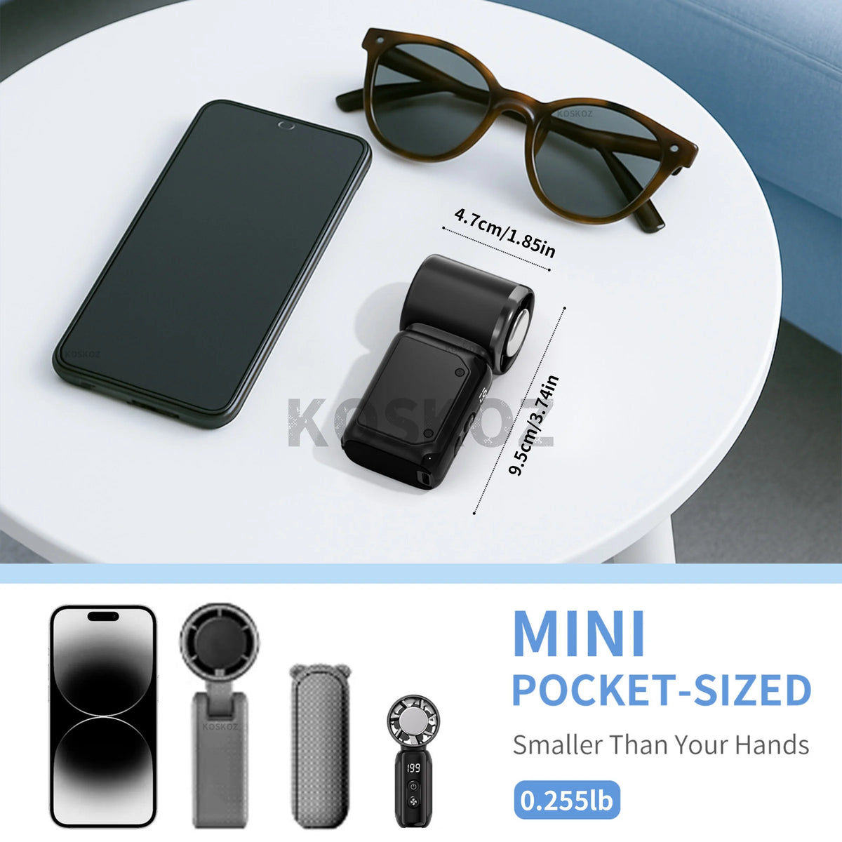 A black mini pocket-sized ice cooling fan is shown on a white table next to a smartphone.
