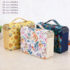 A collection of colorful pencil cases in various sizes and patterns, including floral and geometric designs.