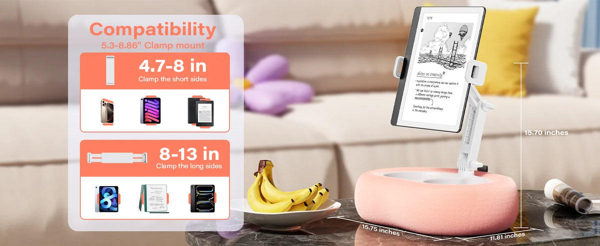 A pink adjustable pillow tablet and Kindle stand with soft plush fabric displayed on a table.