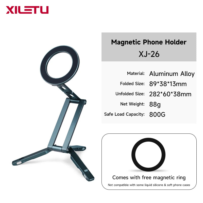 A dark gray magnetic phone holder with a circular ring and adjustable arms.