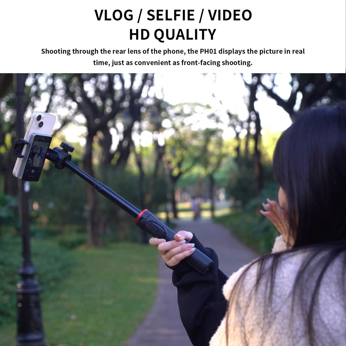 A person is using a magnetic phone rear camera monitor to shoot video, demonstrating HD quality for vlogging.