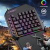 A black T-VOLF one-handed game keyboard with colorful backlight shown against a backdrop of intense combat scenes.