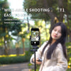 A woman holds a magnetic phone camera monitor for wide-angle shooting in an outdoor setting.