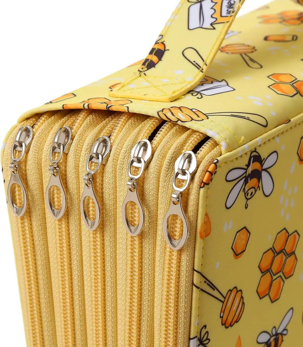 A yellow pencil case with a zipper closure and a pattern featuring bees and other colorful elements.