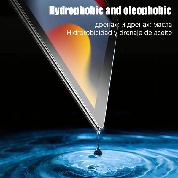 A close-up shot of a tempered glass screen protector dripping onto a blue surface, demonstrating hydrophobic and oleophobic p