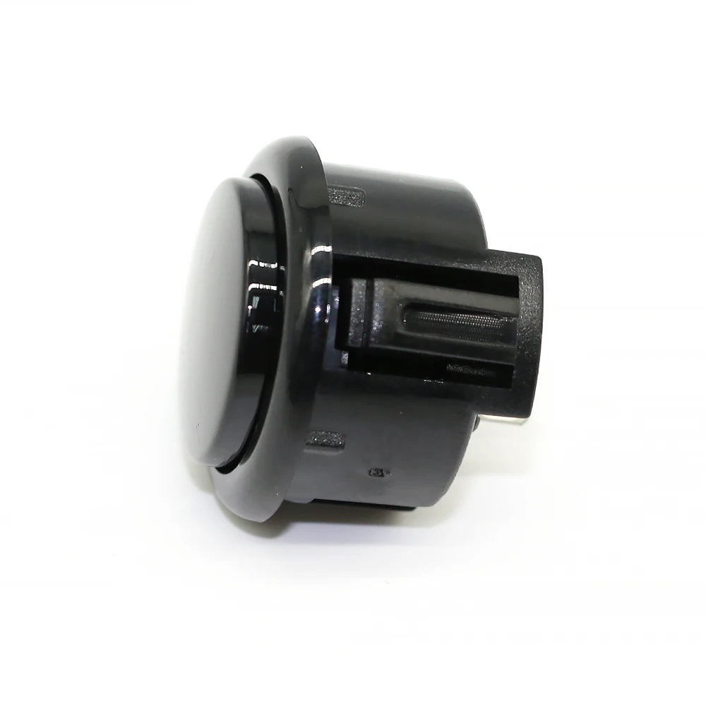 A black arcade push button game switch with a cylindrical body and a rectangular plunger.