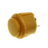 A yellow arcade push button game switch with a round top and a small metal pin visible.
