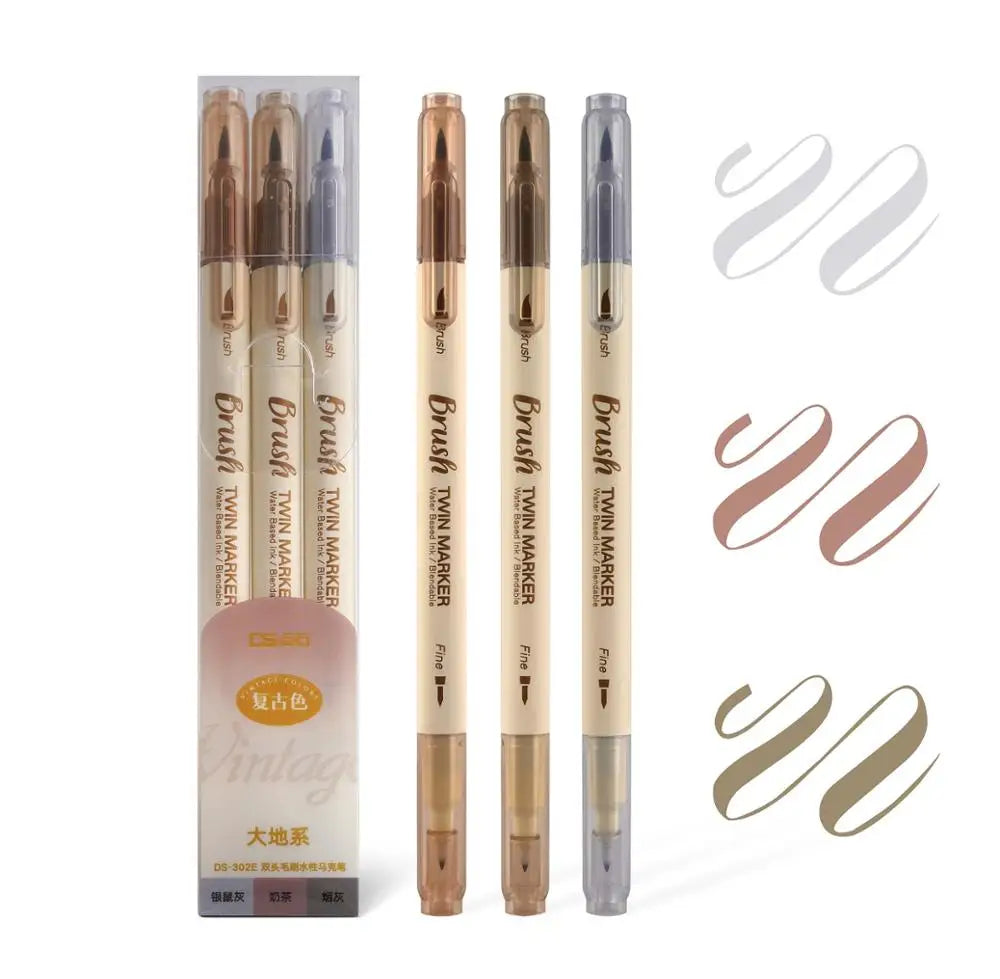 A set of three fine-tipped twin markers in various shades of brown and gray for watercolor art