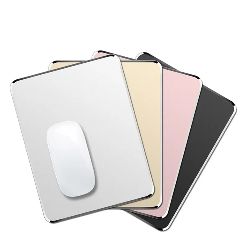 A stack of premium aluminum and PU leather mouse pads in various colors, including white, beige, pink, and black.