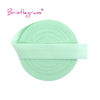 A roll of light mint green adjustable spandex elastic hair ties and trims.