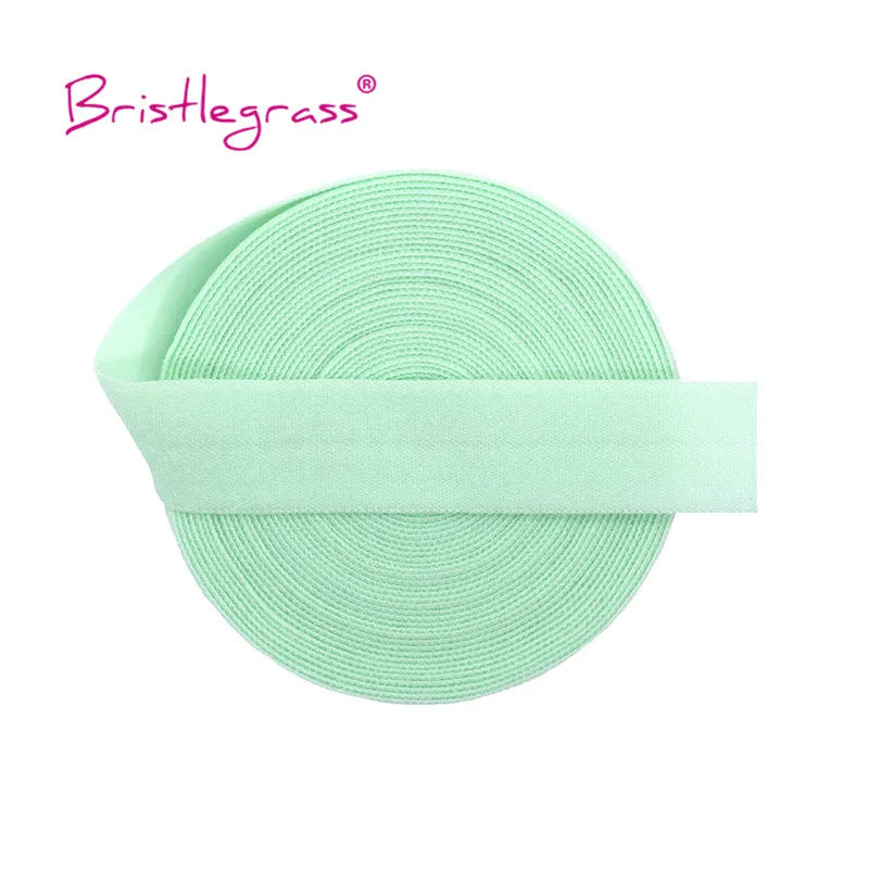 A roll of light mint green adjustable spandex elastic hair ties and trims.