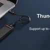 A Thunderbolt 3 NVMe SSD enclosure connected to a laptop, demonstrating high-speed data transfer.