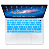 A white silicone keyboard cover for a MacBook Air or MacBook Pro is shown open with the screen displaying a colorful wallpape