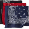 A stack of three dark blue and red paisley print cotton bandana square scarves.