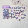 A collection of colorful butterfly wings PET stickers for scrapbooking and journaling displayed on a white surface.
