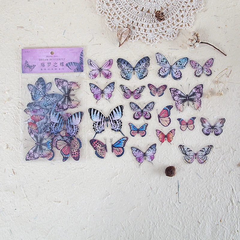 A collection of colorful butterfly wings PET stickers for scrapbooking and journaling displayed on a white surface.