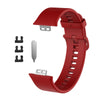 Rotes Silikonarmband für einen Fitness-Tracker, gezeigt mit verschiedenen Komponenten.