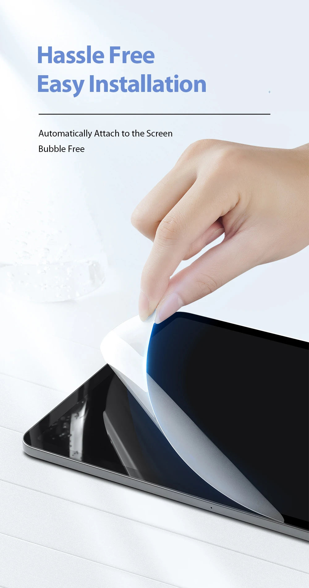 A hand is applying a clear matte screen protector to an iPad screen.