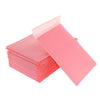 A stack of pink self-sealing bubble mailers, padded envelopes, ready for mailing.