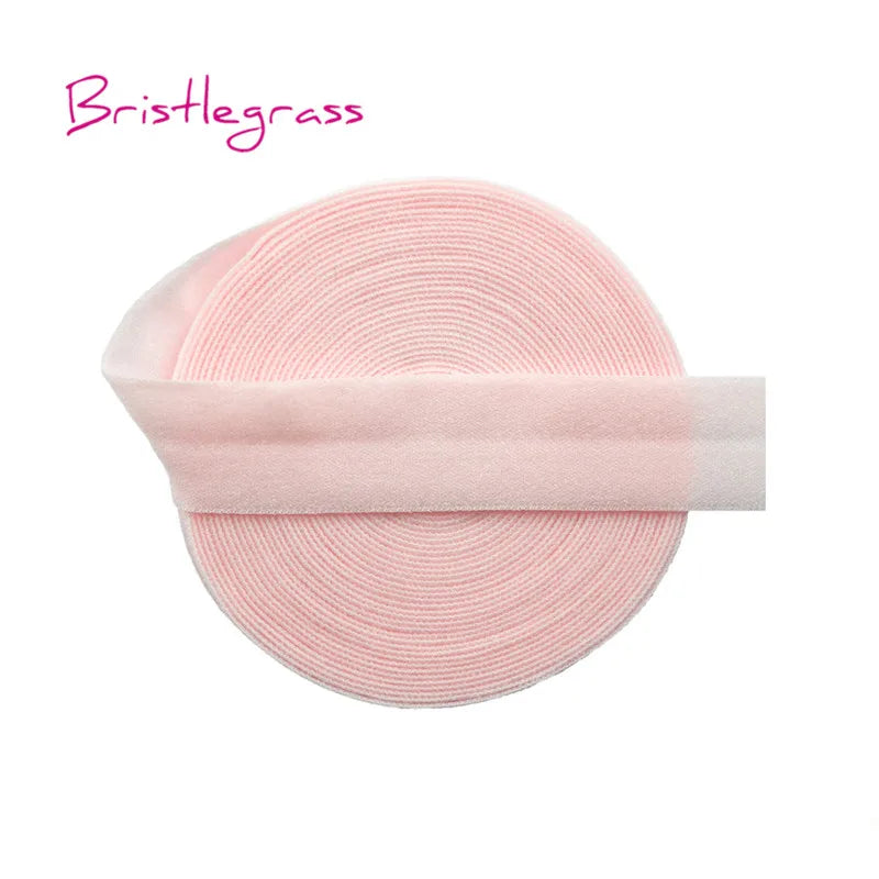 A pink bristleglass elastic hair tie with a translucent pink trim.