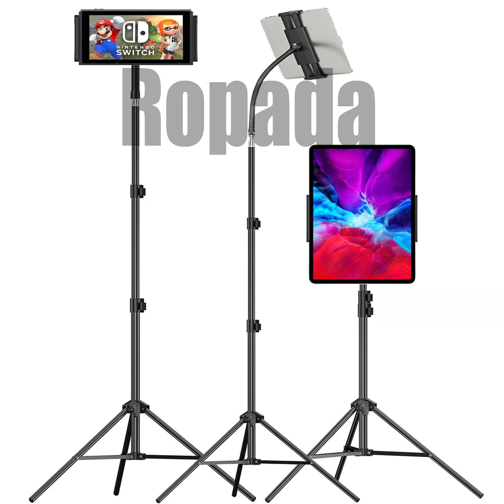 A black adjustable tripod stand holding a tablet, used as a mount for mobile phones.
