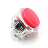 Clear plastic arcade push button game switch with a pink top cap