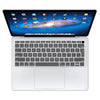 A white silicone keyboard cover for a MacBook Air or Pro, shown open with the laptop.