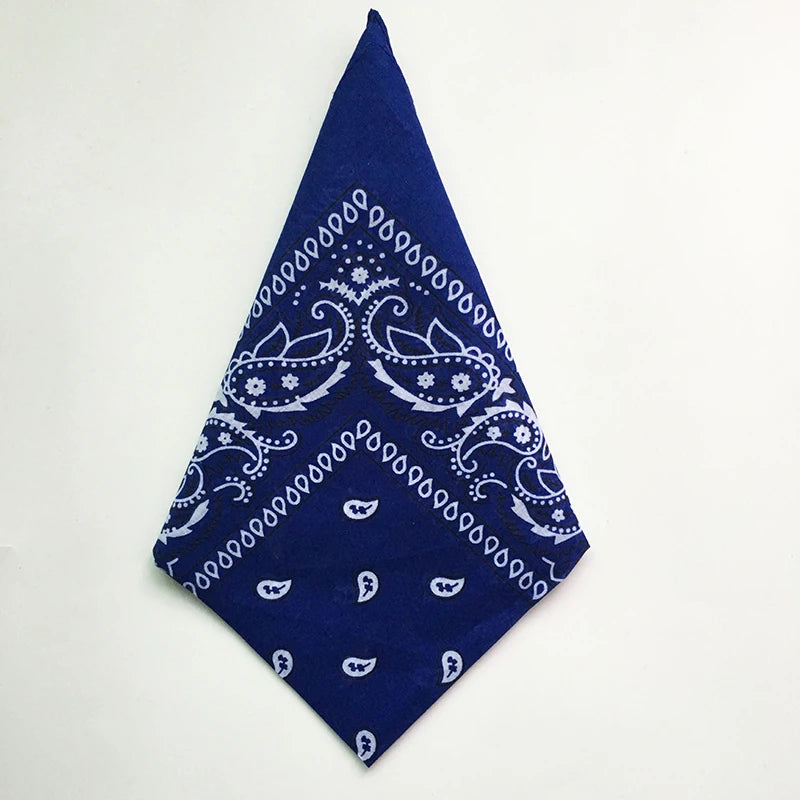 A dark blue cotton bandana square scarf featuring a white paisley print.