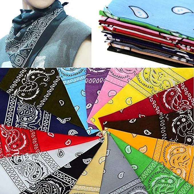 A collection of colorful paisley print cotton bandana square scarves folded and displayed.
