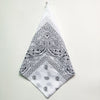 A white cotton bandana square scarf featuring an intricate black paisley print.