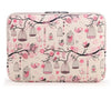 A pink floral patterned canvas laptop sleeve designed for a MacBook or PC.