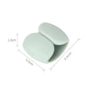 A white silicone cable organizer clip with dimensions 1.3cm by 3.2cm.