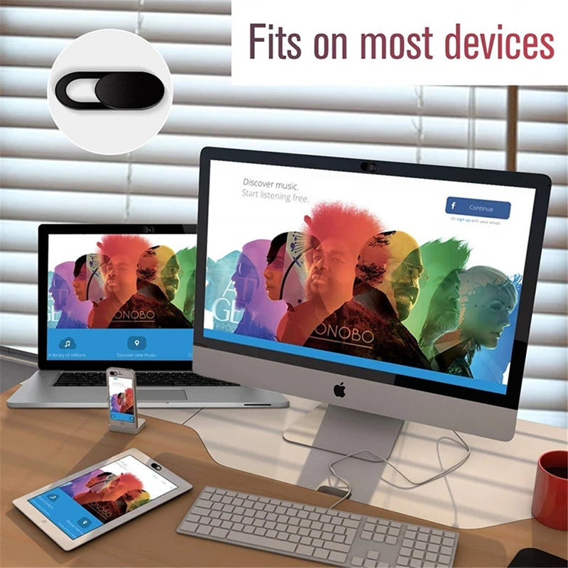 Privacy sliding camera covers for laptops and devices shown next to a laptop, tablet, and keyboard.