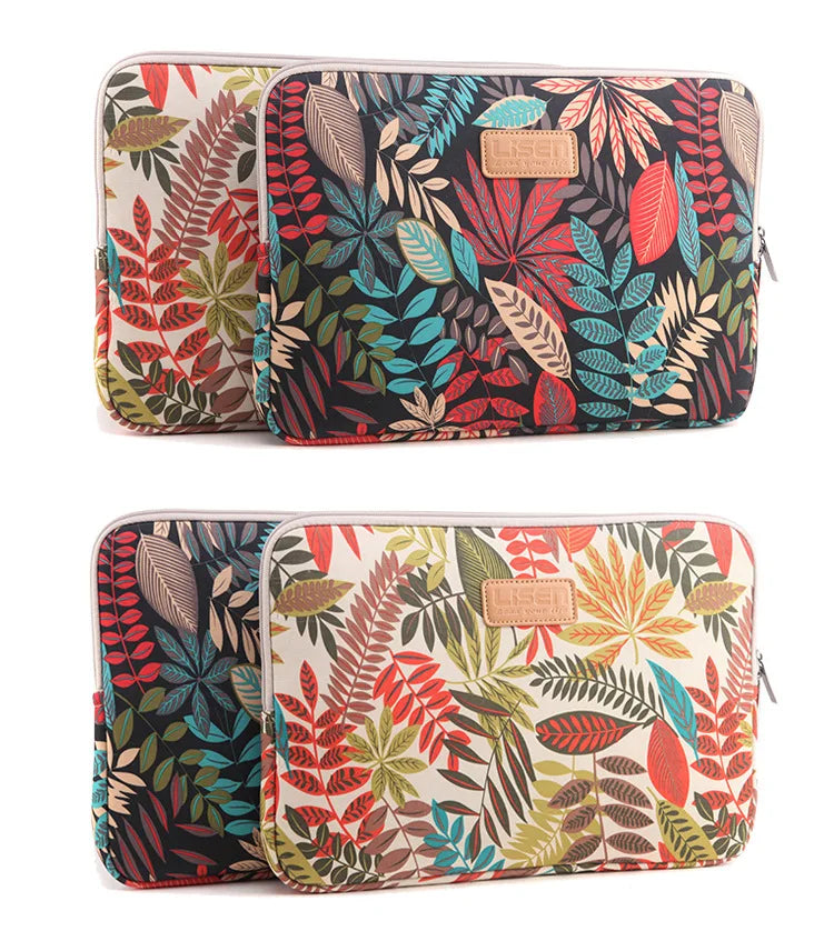 A pair of patterned canvas laptop sleeves featuring tropical leaves and floral designs.