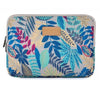 A laptop sleeve featuring a tropical leaf pattern in blue, green, and beige tones.