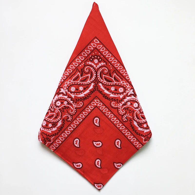 A red cotton bandana square scarf featuring an intricate white paisley print.