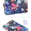 A purple and blue galaxy-themed laptop sleeve or laptop bag.