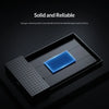 A black external drive enclosure with a blue silicone sponge cushion protecting a hard drive inside.
