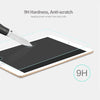 A knife is shown touching a tablet screen protected by a 9H hardness anti-scratch tempered glass screen protector.