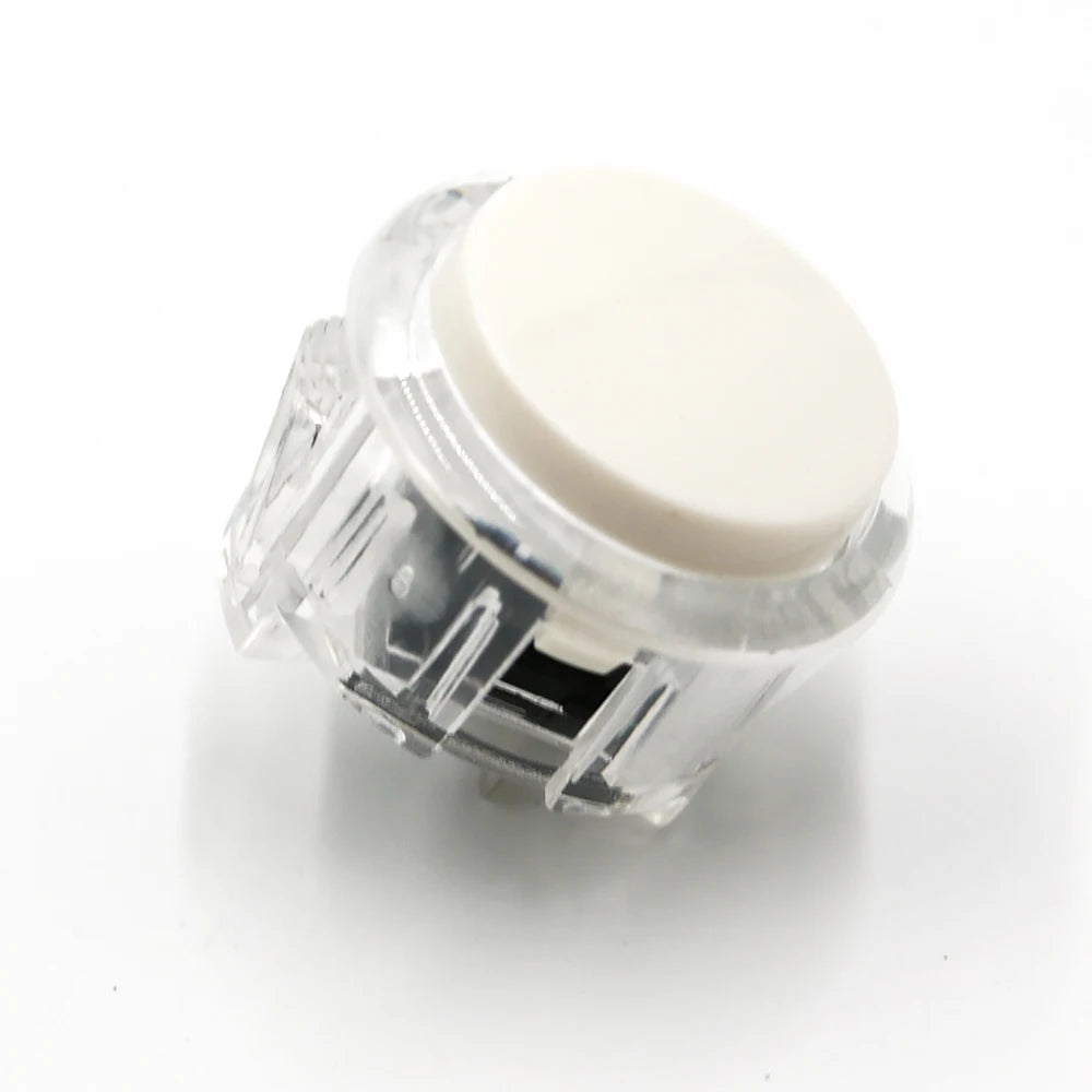 Clear plastic arcade push button game switch with a white top cap