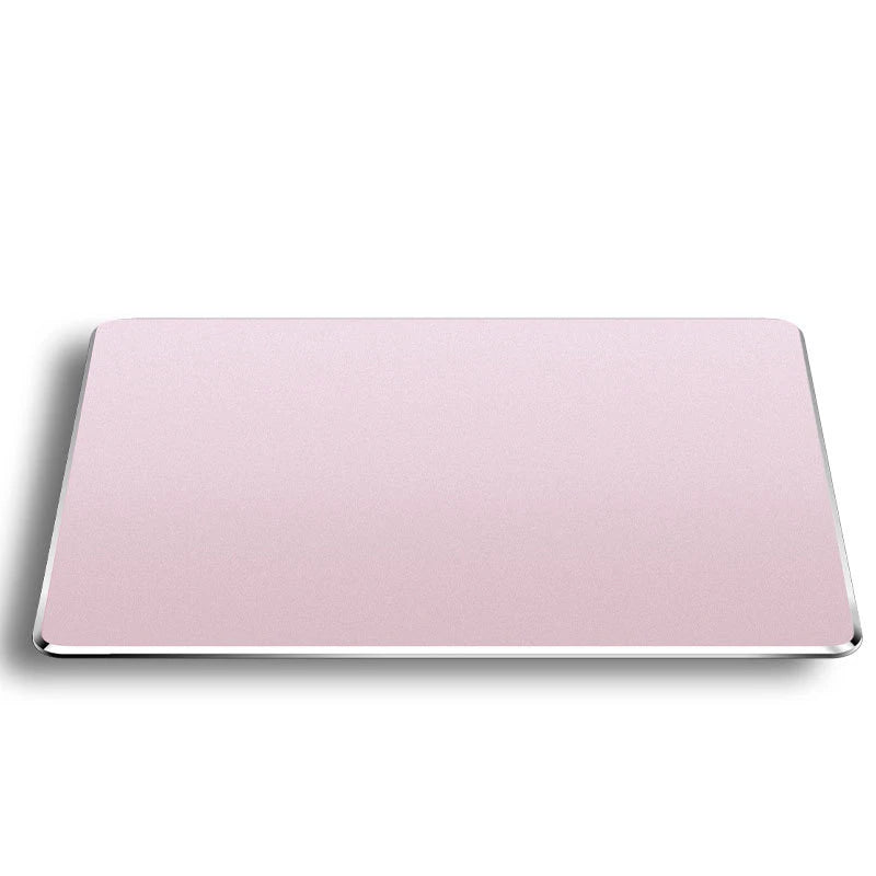 A rectangular pink mouse pad made of aluminum and PU leather.